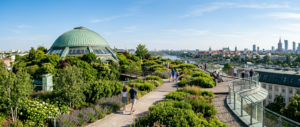 A professional editorial wide-angle shot of the lush green rooftop garden of the Warsaw University L